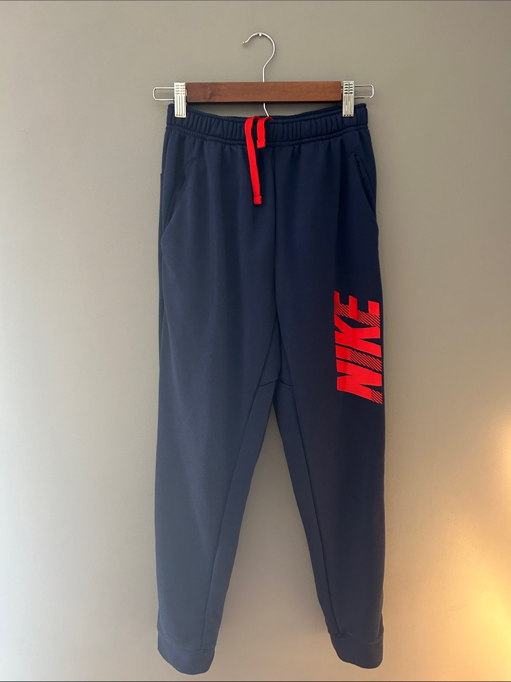 Nike Kids Navy Sweatpants with Red Logo and Drawcord
